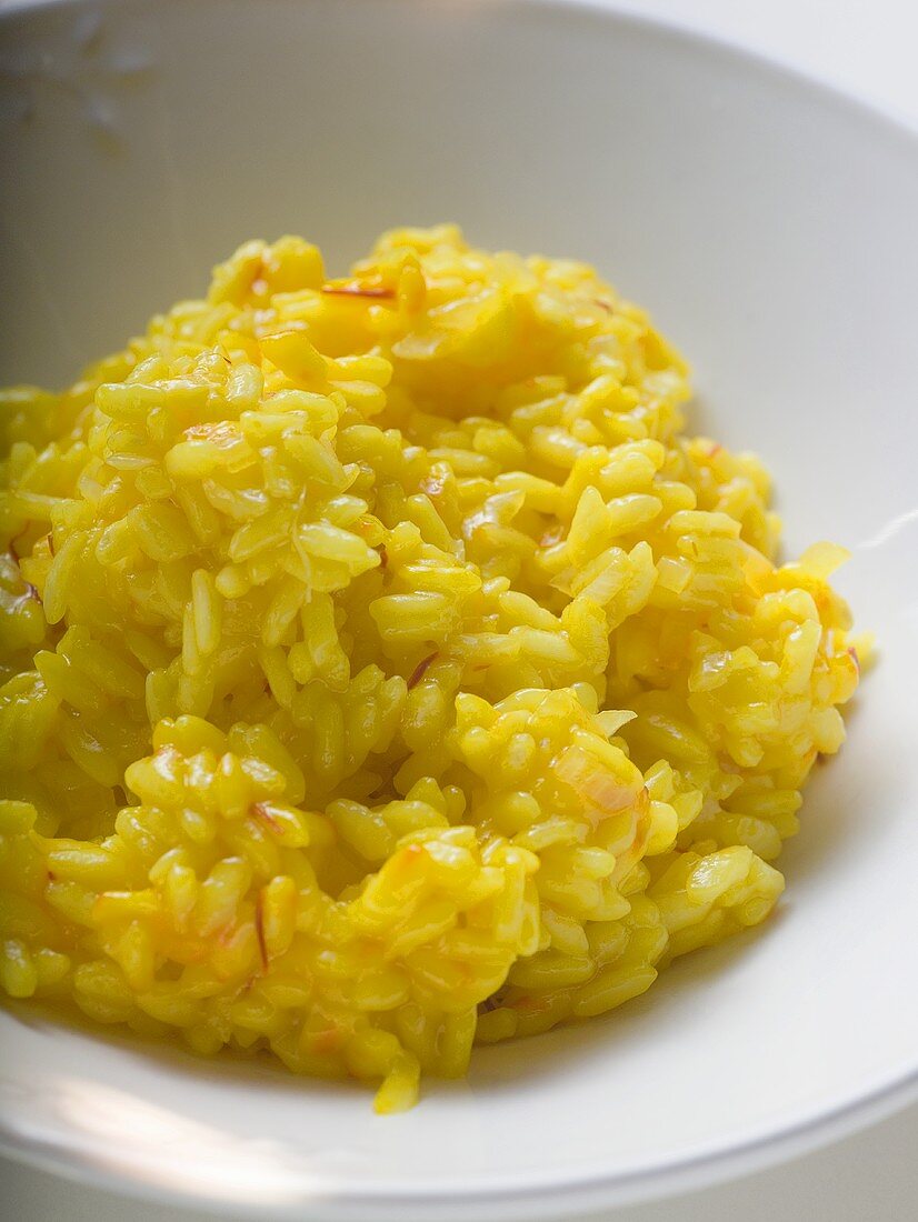 Saffron risotto on white plate