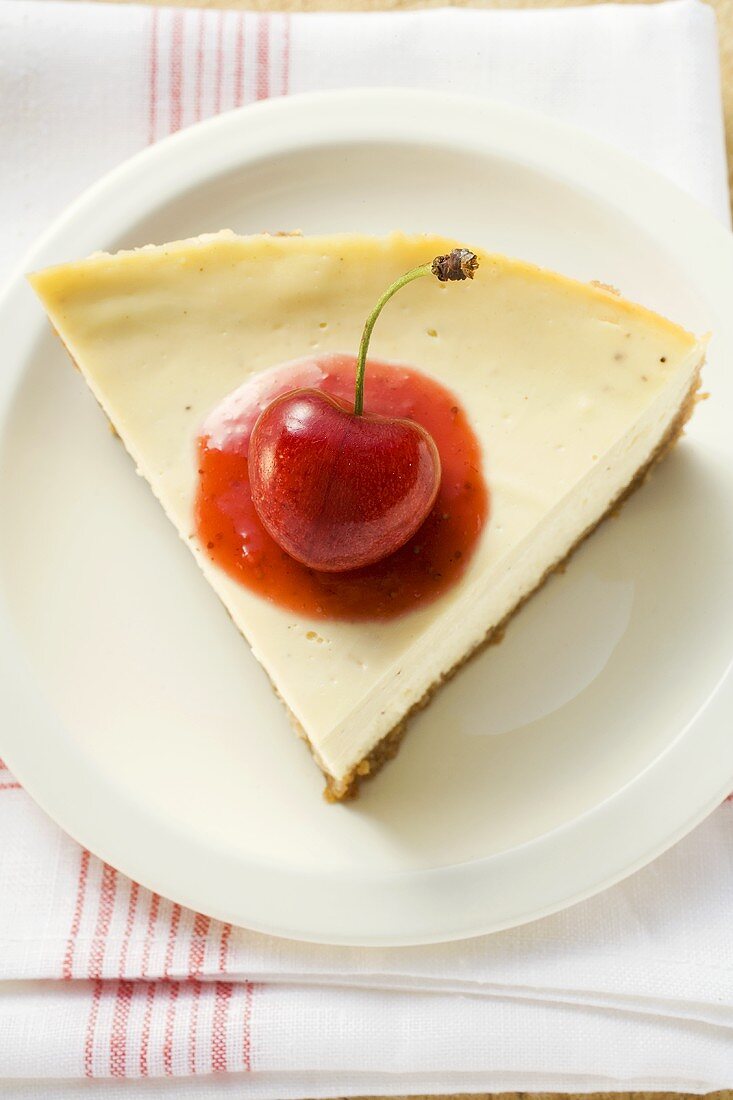 Piece of cheesecake with cherry