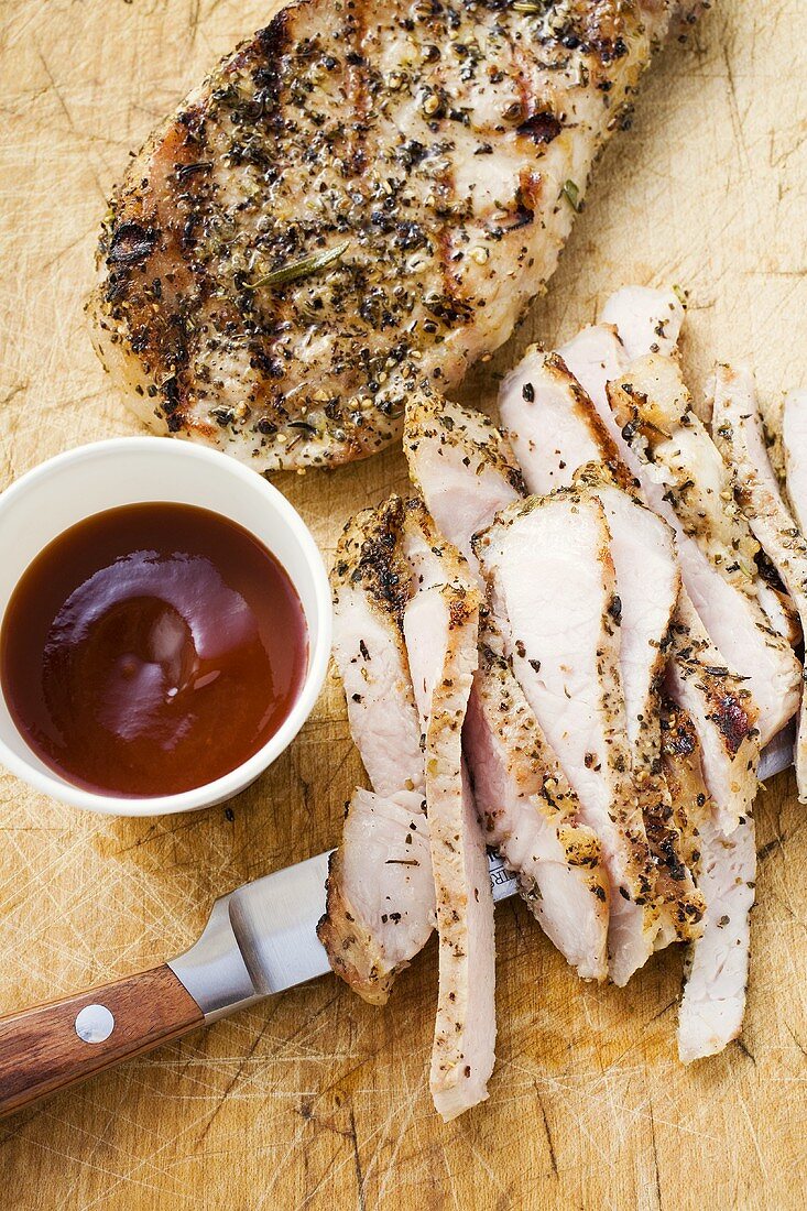 Pork chops, partly sliced, with barbecue sauce