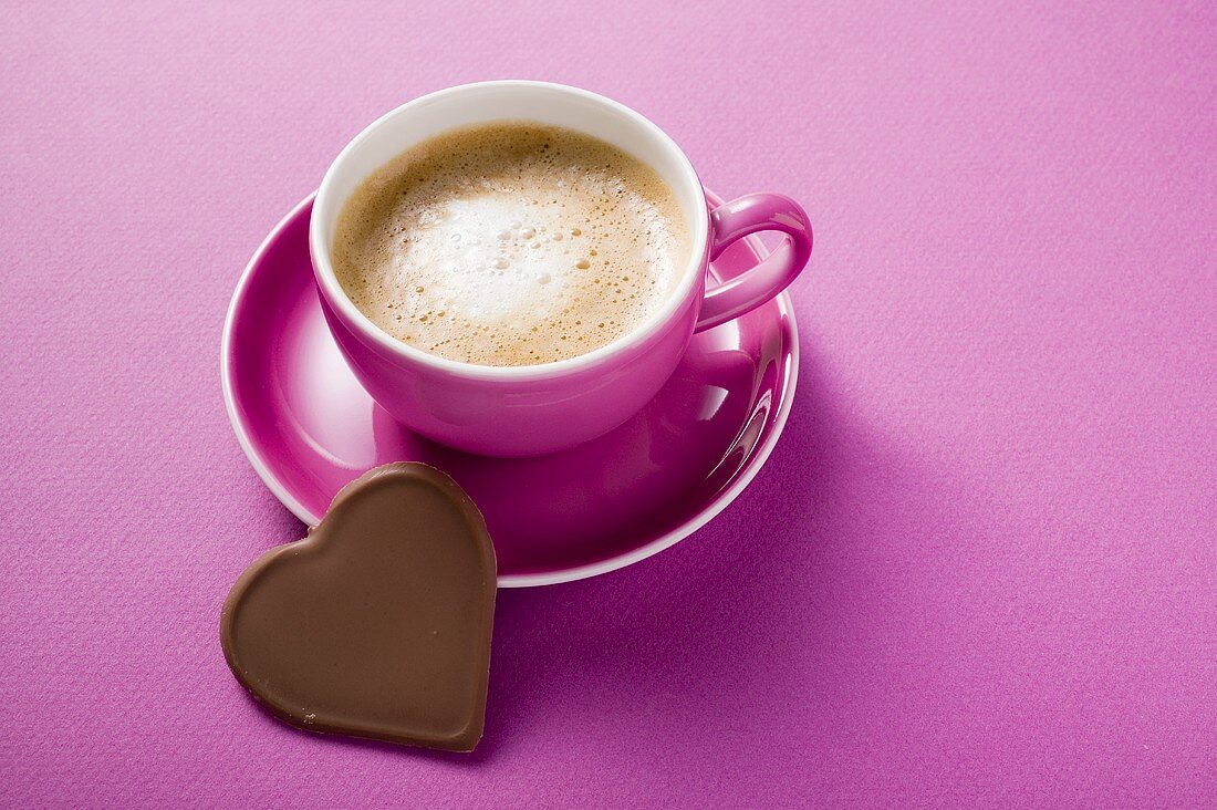 Cup of cappuccino with chocolate heart