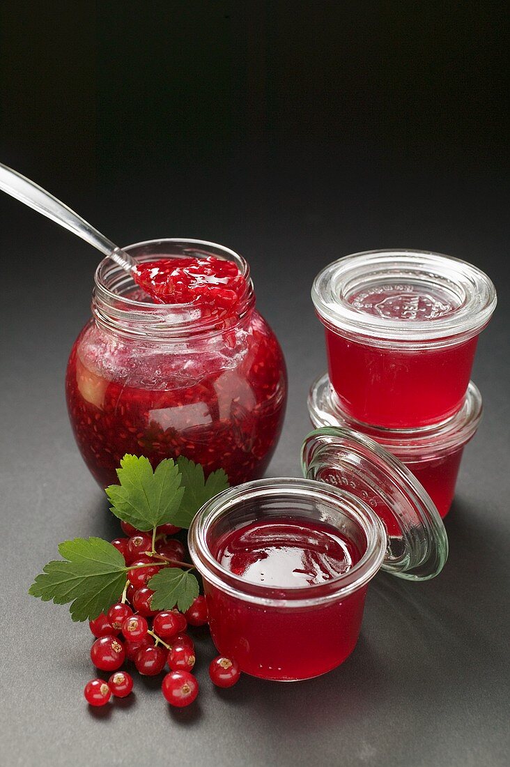 Raspberry jam, redcurrant jelly, redcurrants, leaves