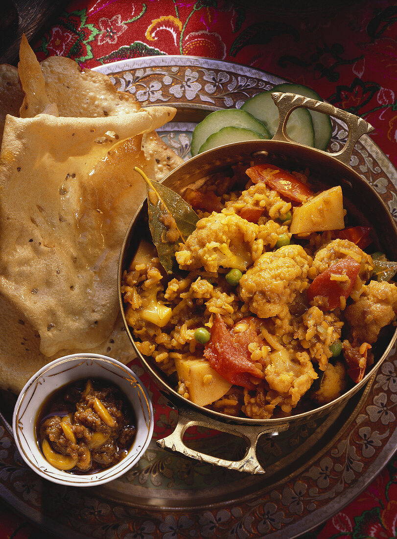 Rice, lentil and vegetable stew and poppadoms