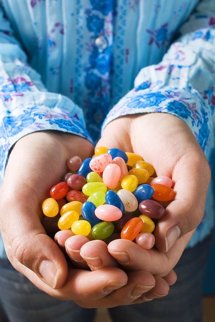 Hands holding jelly beans