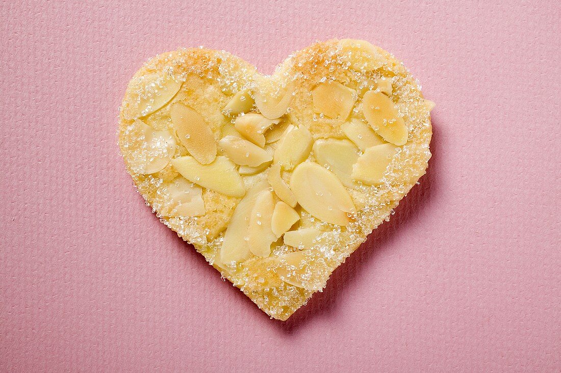 Pastry heart with flaked almonds and sugar