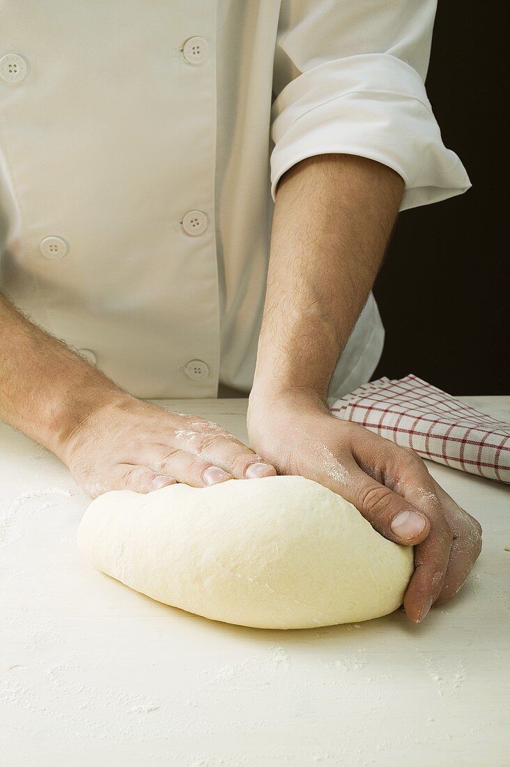 Kneading pizza dough