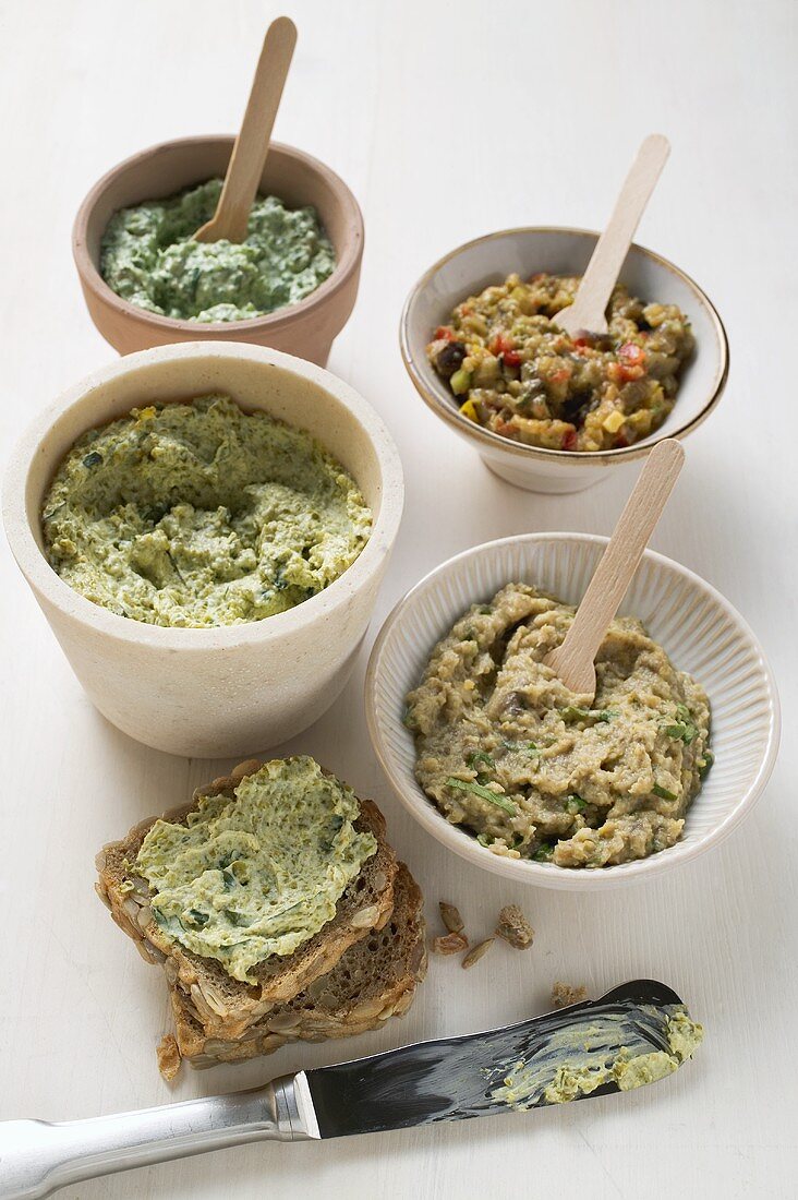 Assorted spreads with wholemeal bread and knife