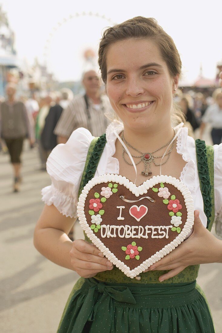 Woman with Lebkuchen heart (Oktoberfest, Munich)