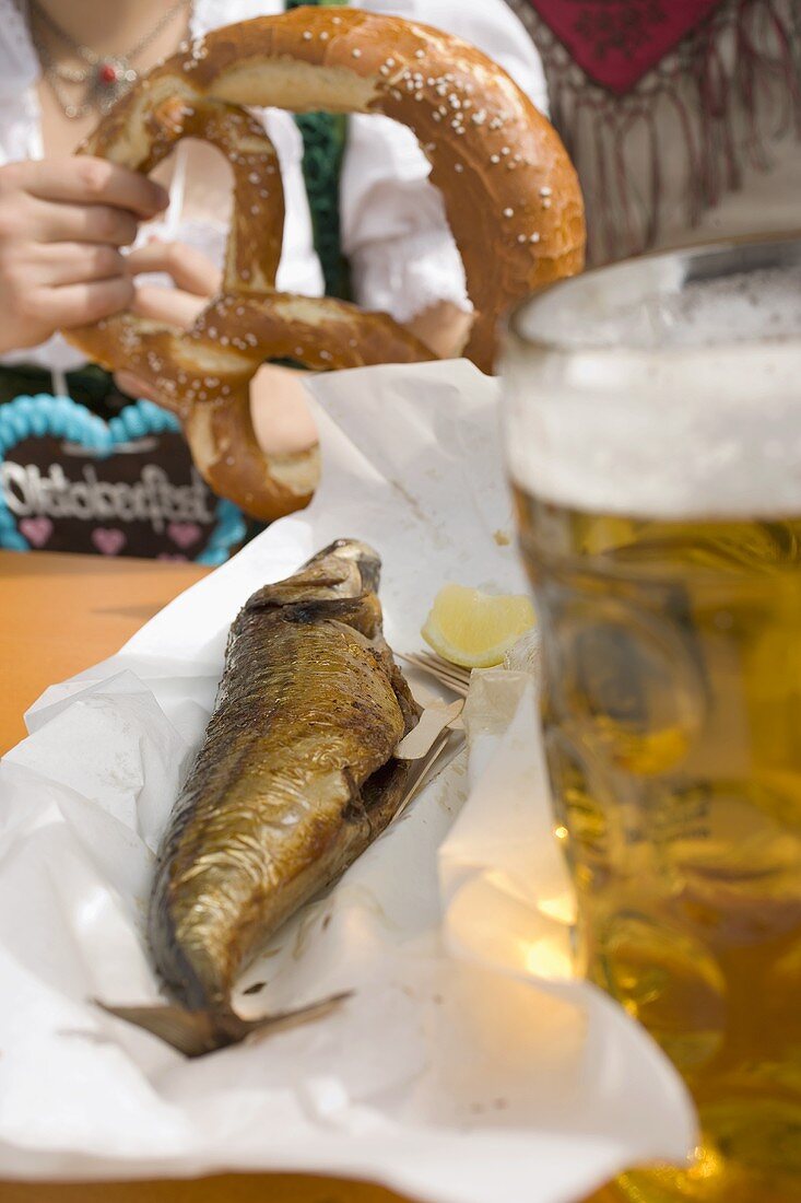 Steckerlfisch (fish on stick), beer, pretzel (Oktoberfest, Munich)