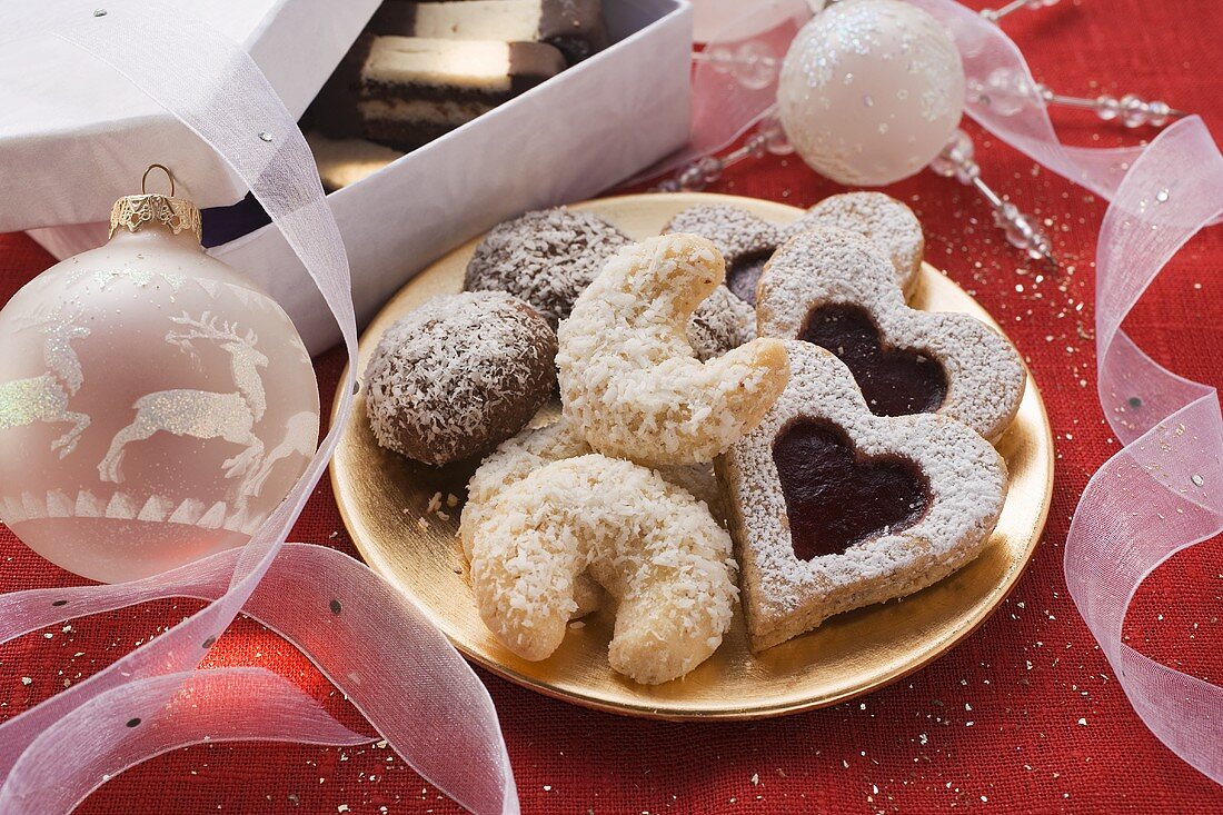 Assorted Christmas biscuits on plate and in box