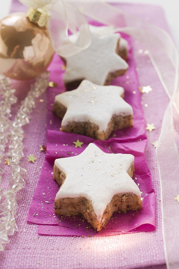 Cinnamon stars on purple paper