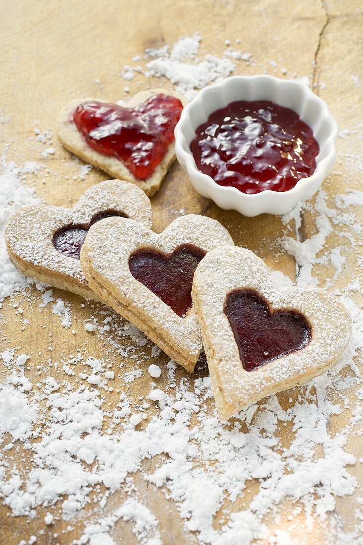 Heart-shaped biscuits filled with raspberry jam