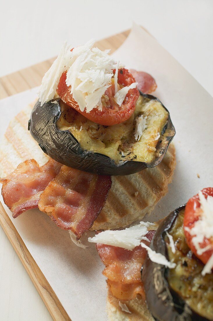 Bacon, grilled aubergine, tomato and Parmesan on toast