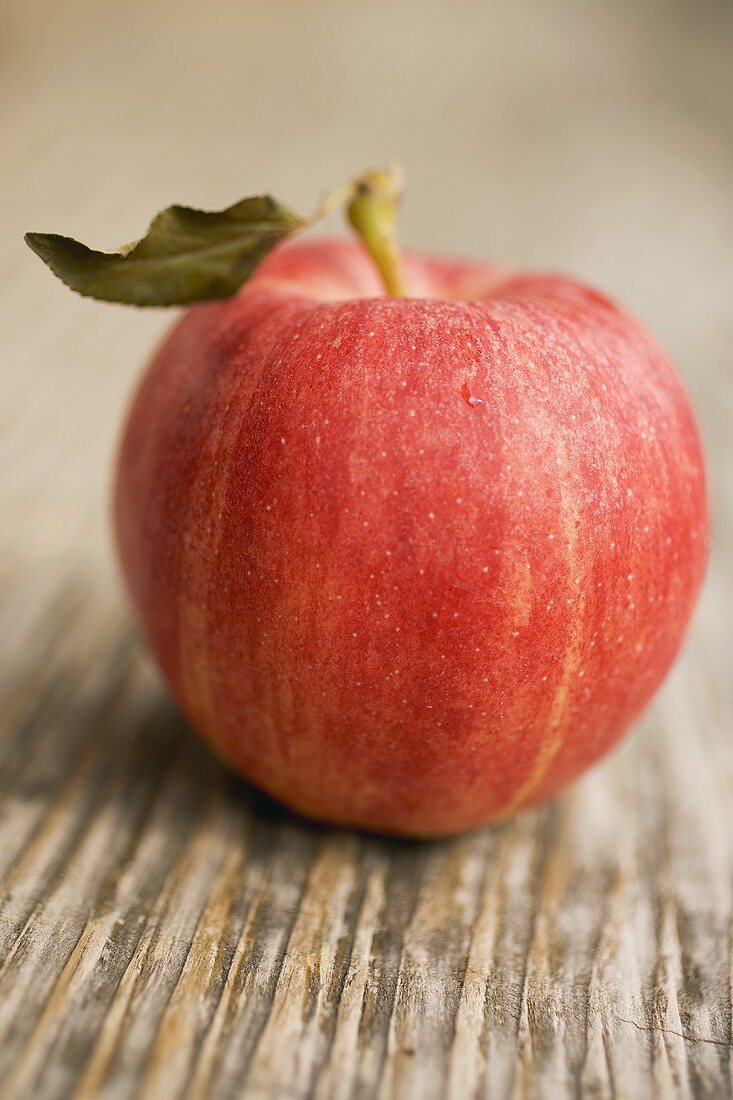 A Gala apple with leaf