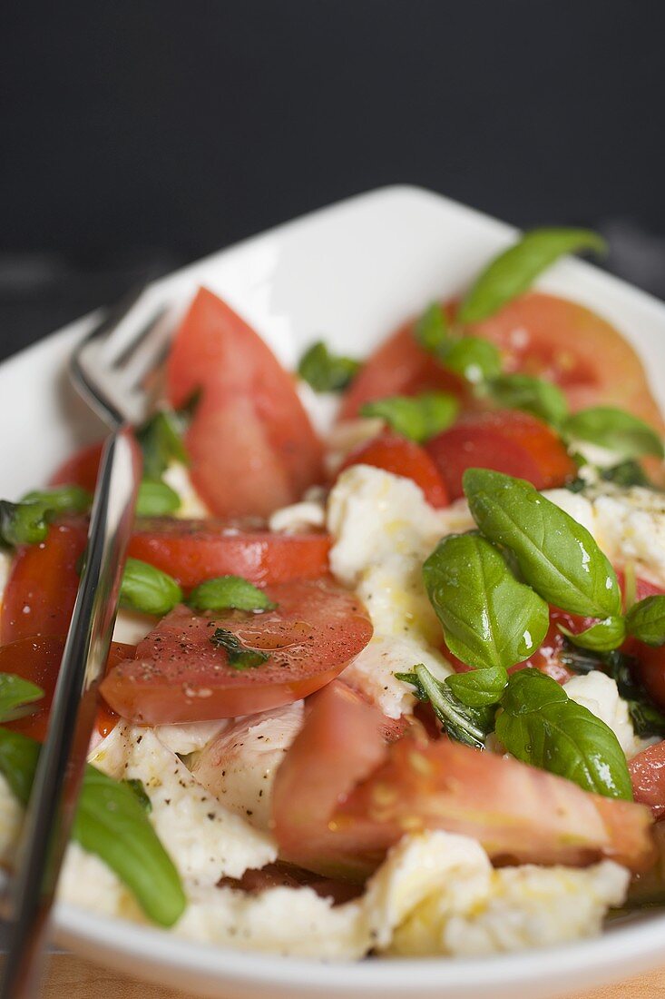 Tomatoes with mozzarella and basil