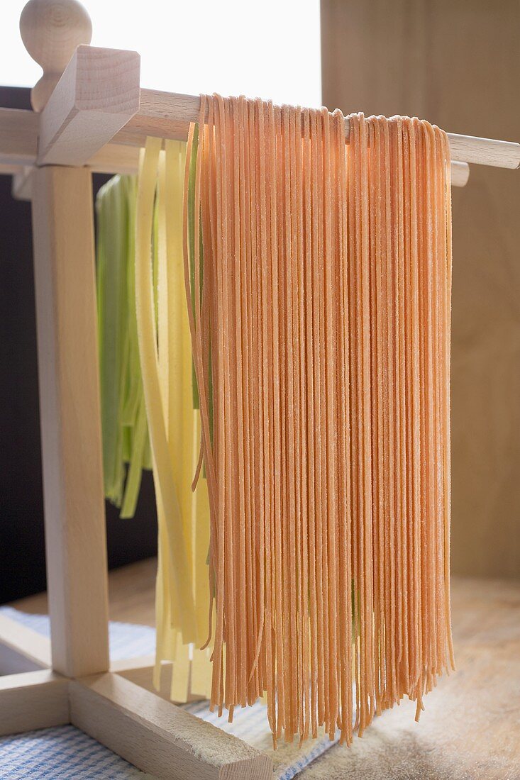 Home-made pasta, hanging up to dry