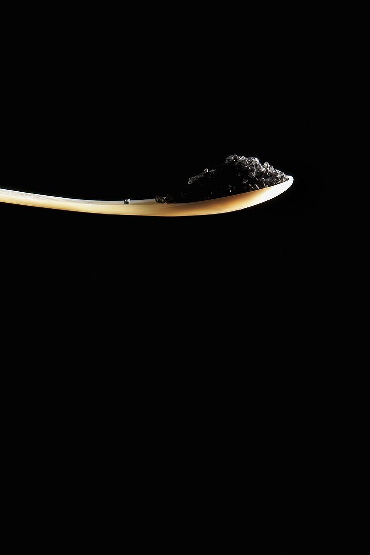 Black salt on spoon
