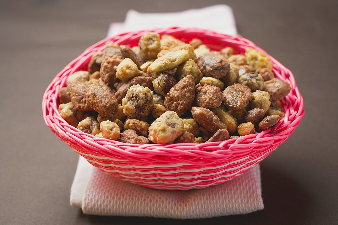 Mixed nuts to nibble in pink basket