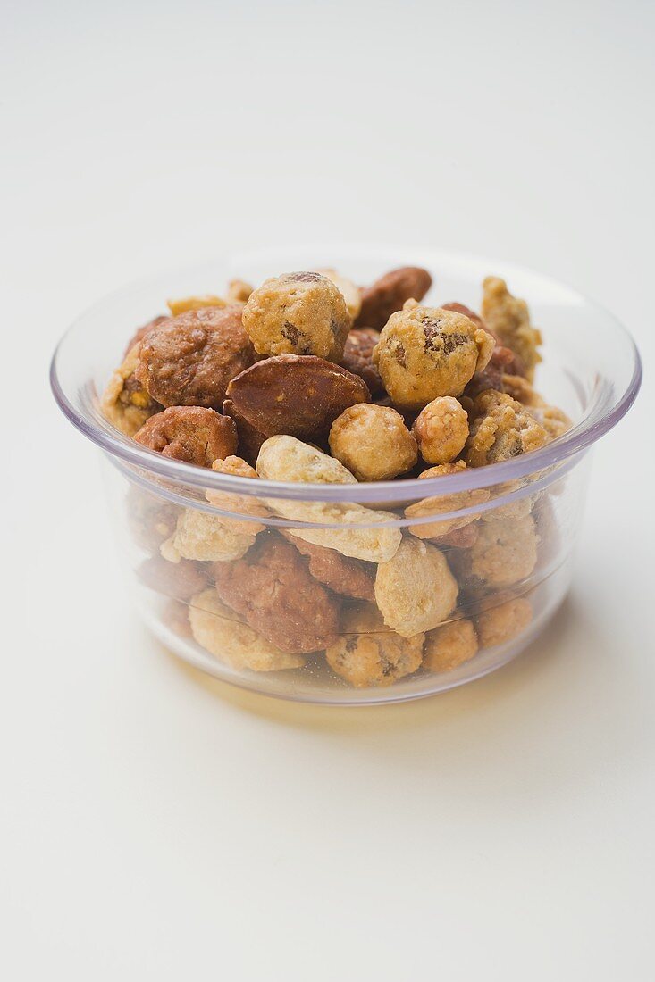 Mixed nuts to nibble in glass bowl