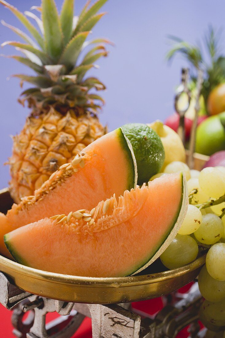 A selection of fruit on kitchen scales