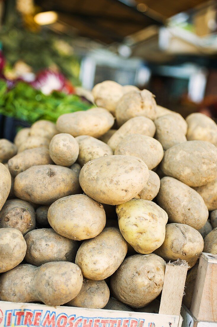 Potatoes in a crate at a market