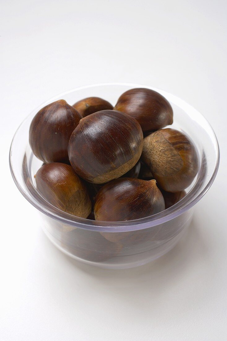 Several chestnuts in glass bowl