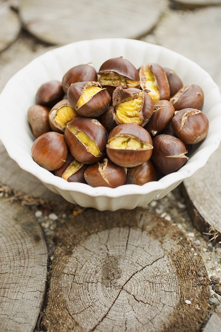 Roasted chestnuts in white bowl
