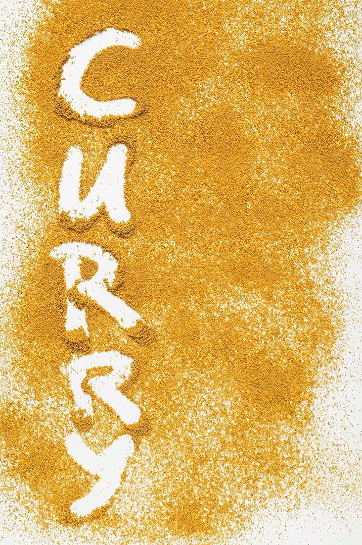 The word 'Curry' written in curry powder