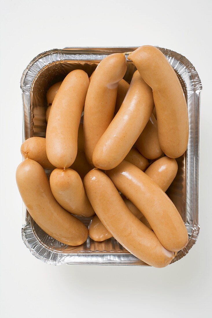 Fresh frankfurters in aluminium container