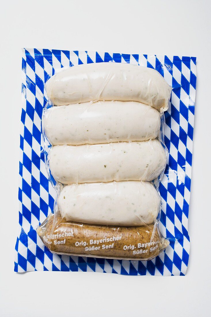 Weisswurst (white sausages) in packaging with mustard