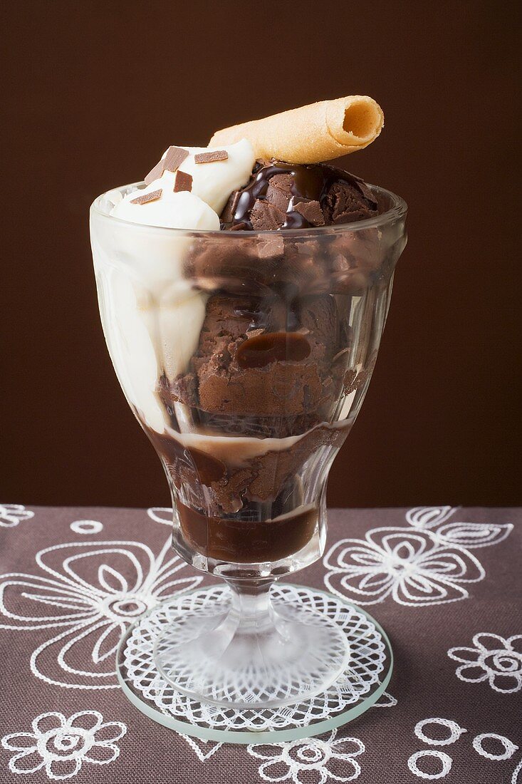 Sundae of chocolate ice cream, cream & wafer curl
