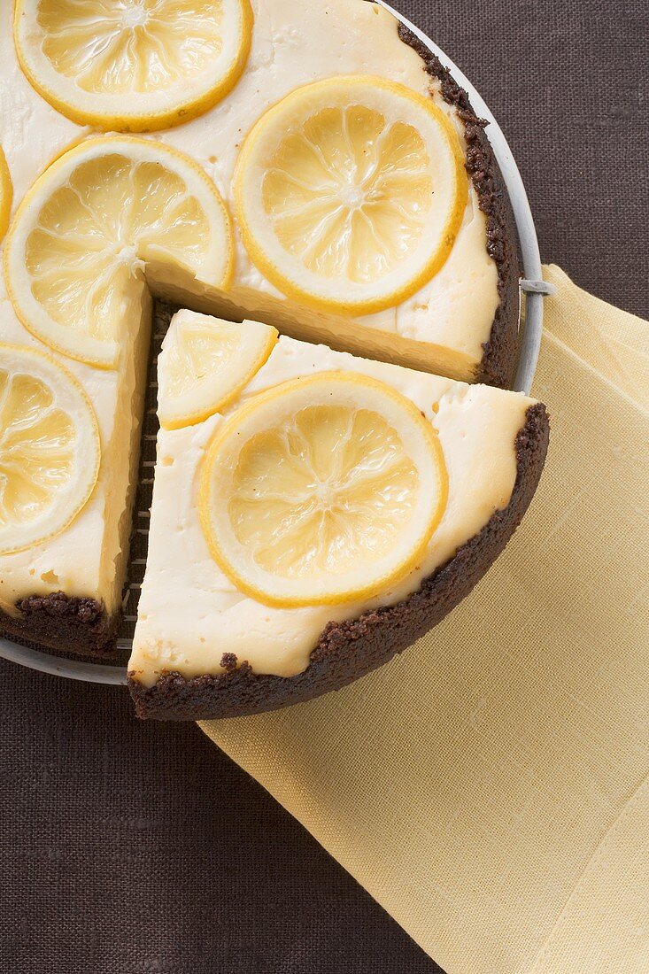 Lemon tart, a slice cut (overhead view)