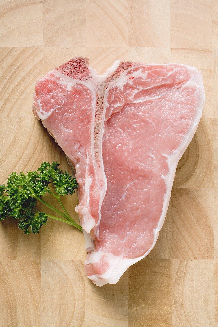 T-bone steak on wooden background