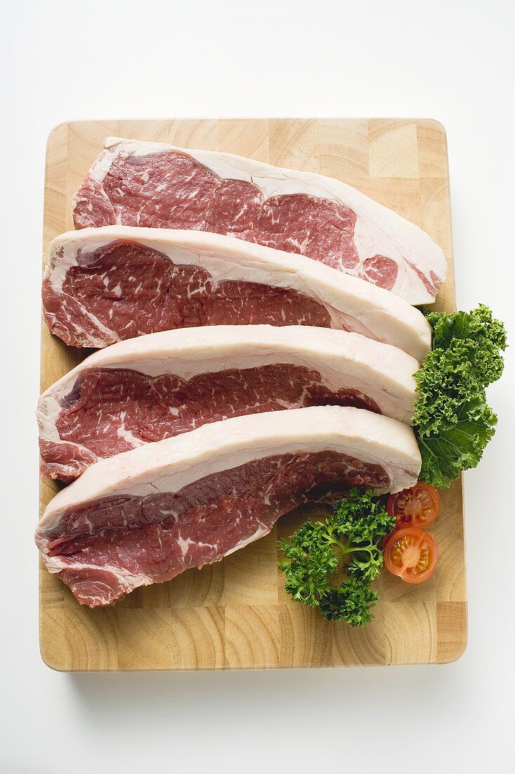 Sirloin steaks on chopping board
