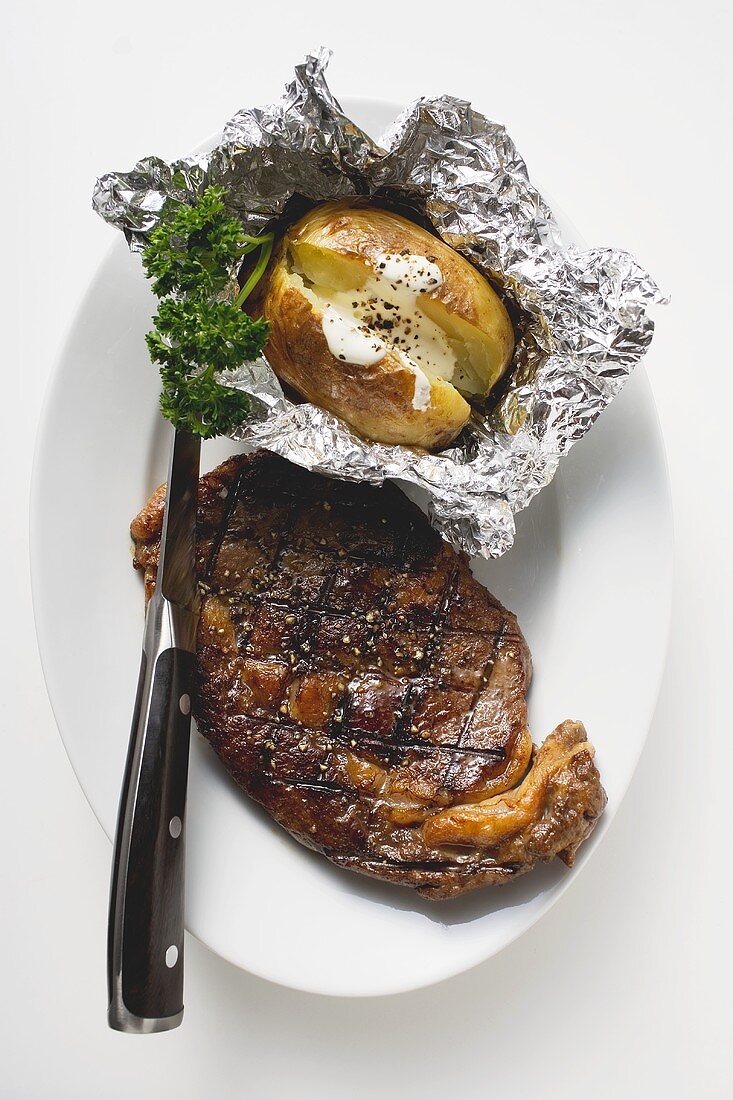 Grilled beef steak with baked potato