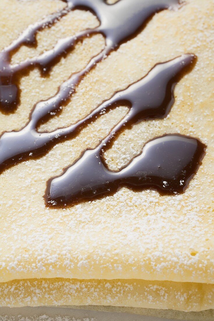 Crêpe with chocolate sauce (close-up)