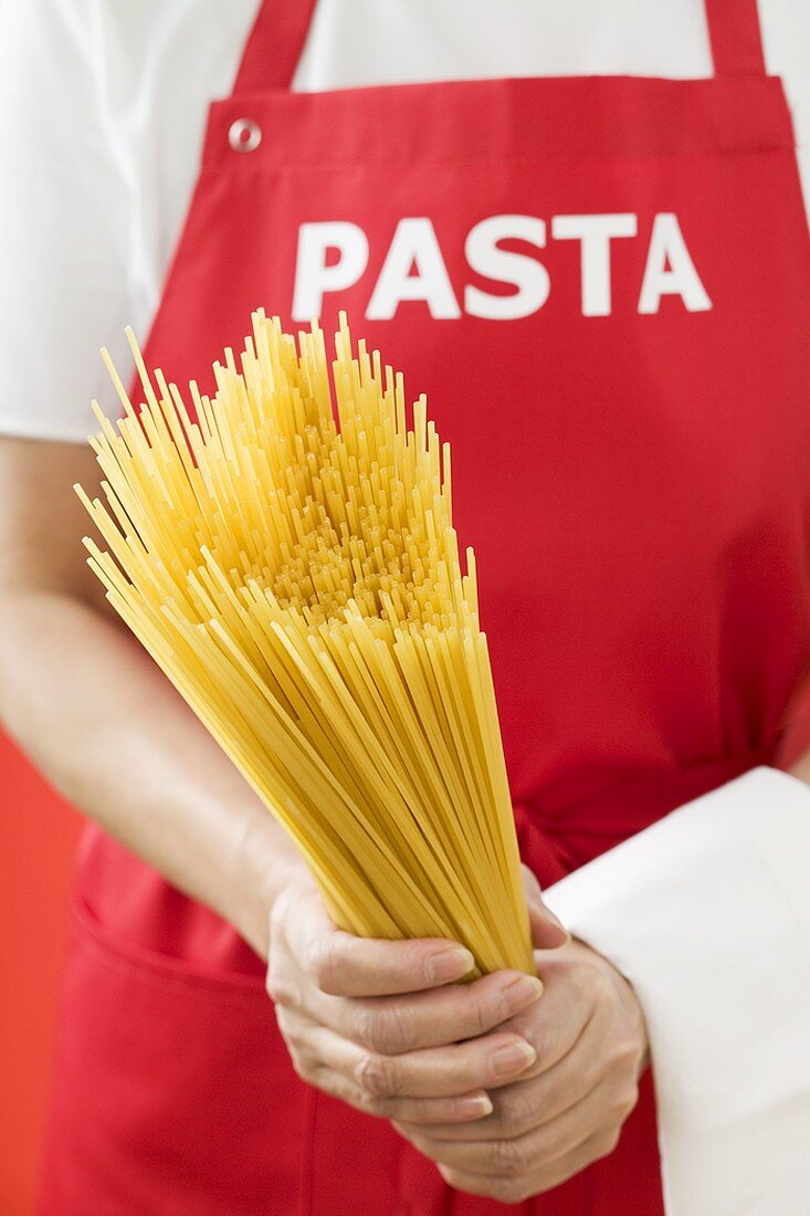 Woman holding spaghetti