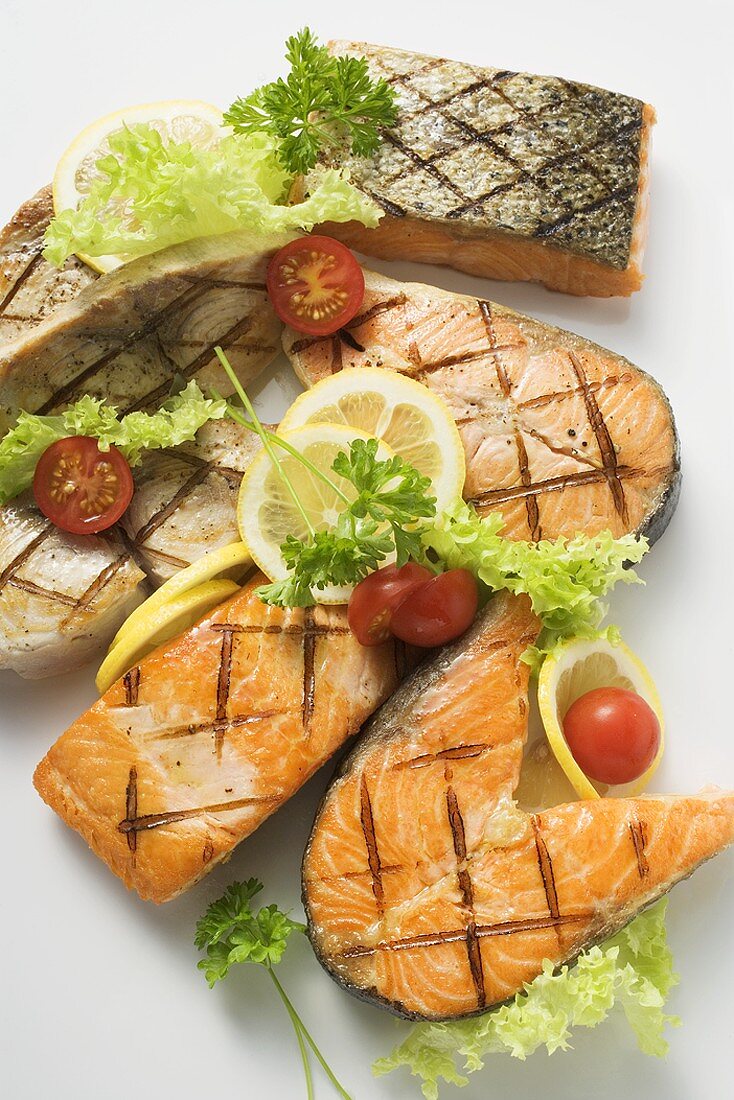 Grilled cutlets and fillets of salmon and cod