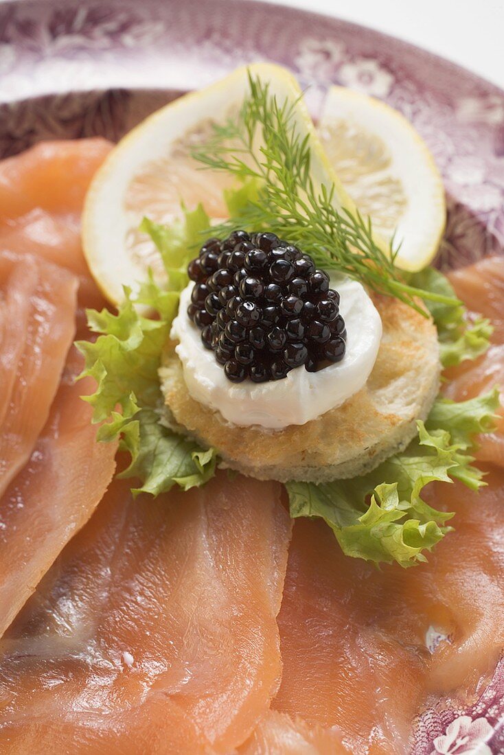 Smoked salmon with caviar and sour cream canapé