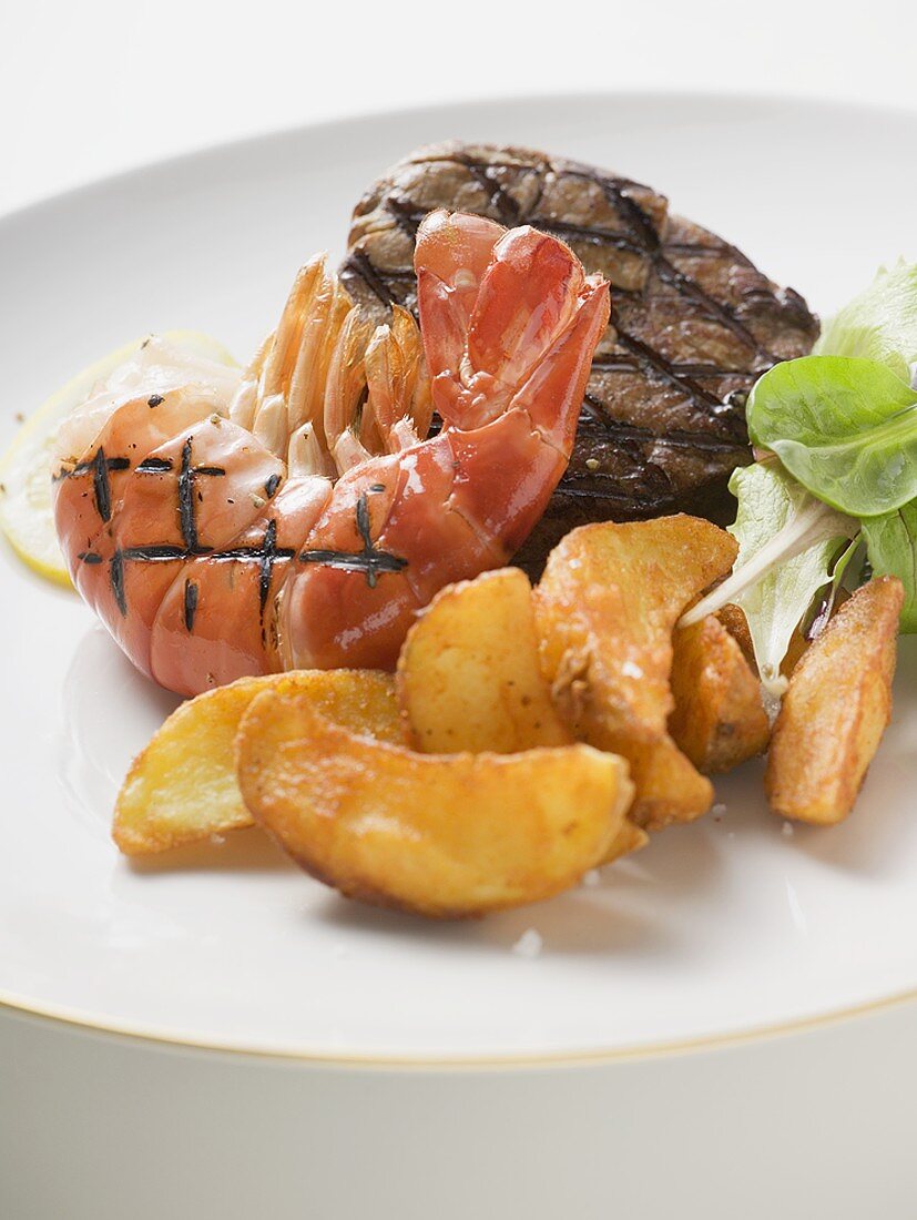 Surf and Turf (prawn and beef steak) with potato wedges
