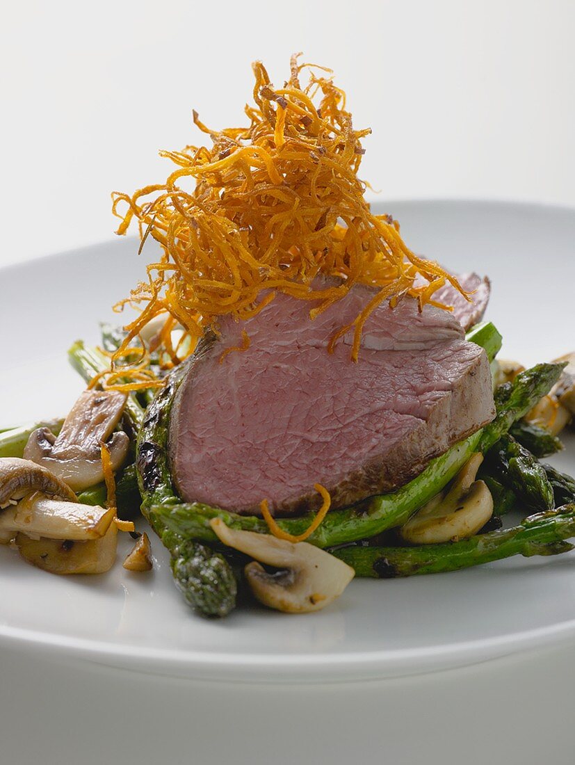 Beef steak with green asparagus and mushrooms