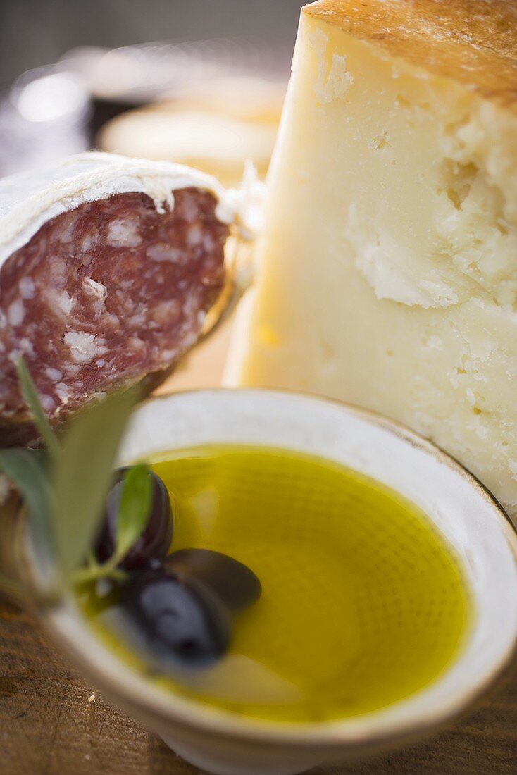Olives, olive oil, Parmesan and salami