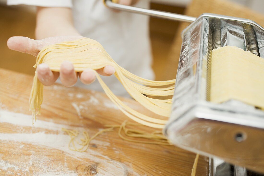 Making home-made ribbon pasta with pasta maker