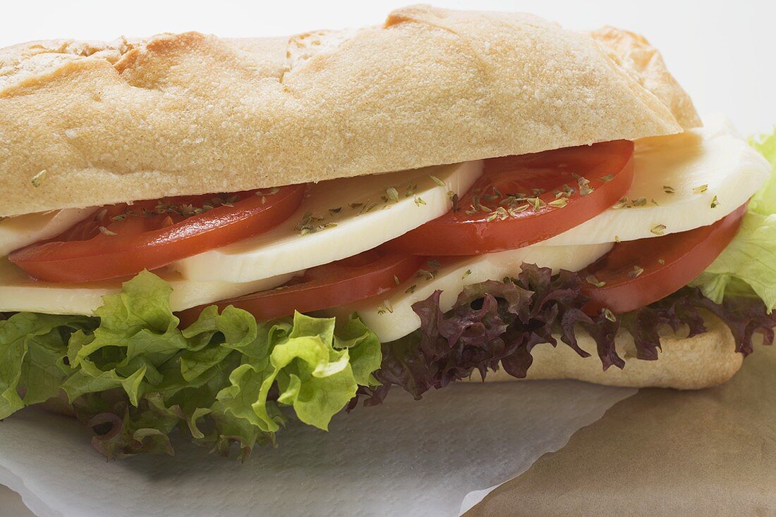 Baguette roll filled with mozzarella and tomato