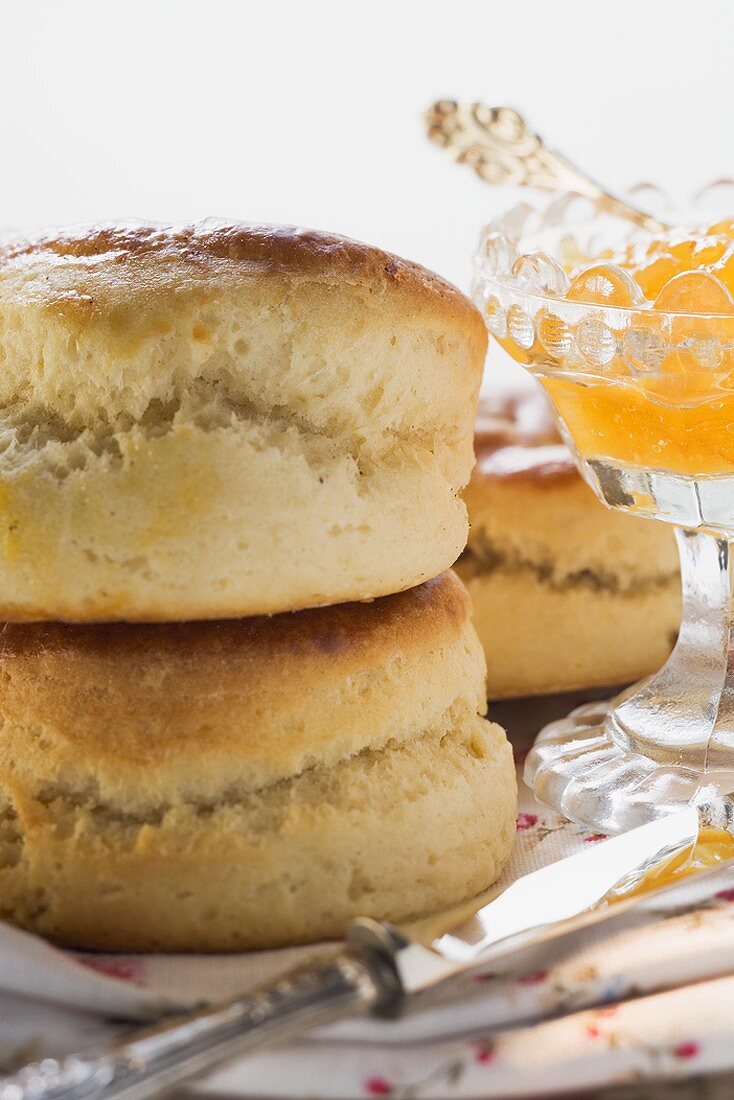 Scones on fabric napkin, orange marmalade