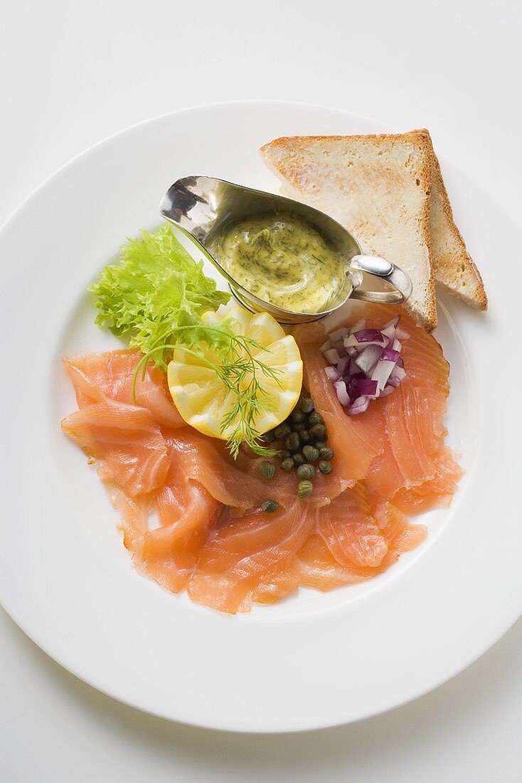 Smoked salmon with capers, mustard & dill sauce and toast