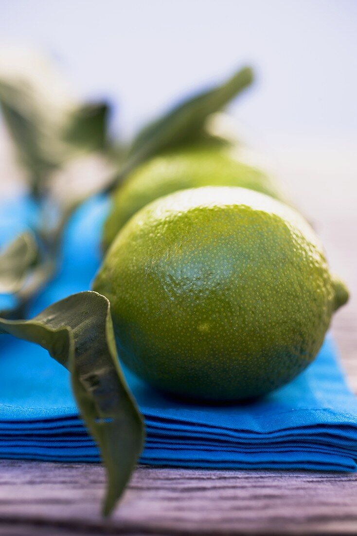 Limes on blue cloth