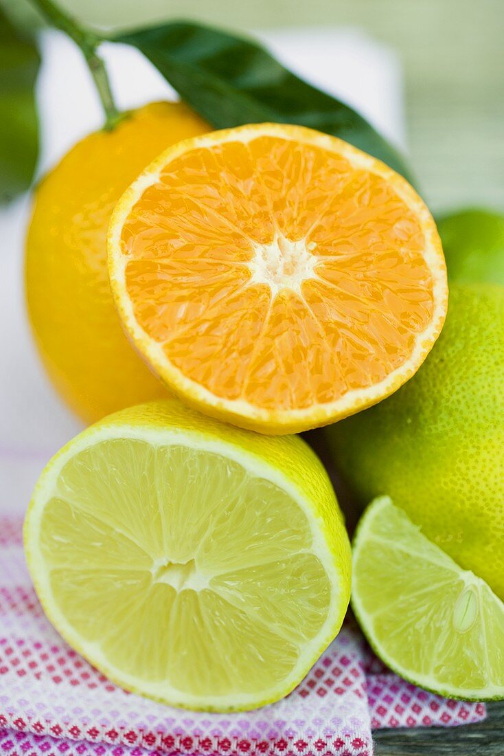 Assorted citrus fruit, whole and halved