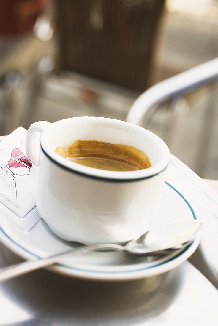 Cup of espresso on table in café