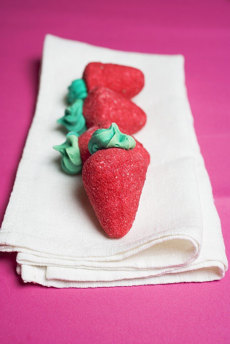 Sugar strawberries on linen cloth