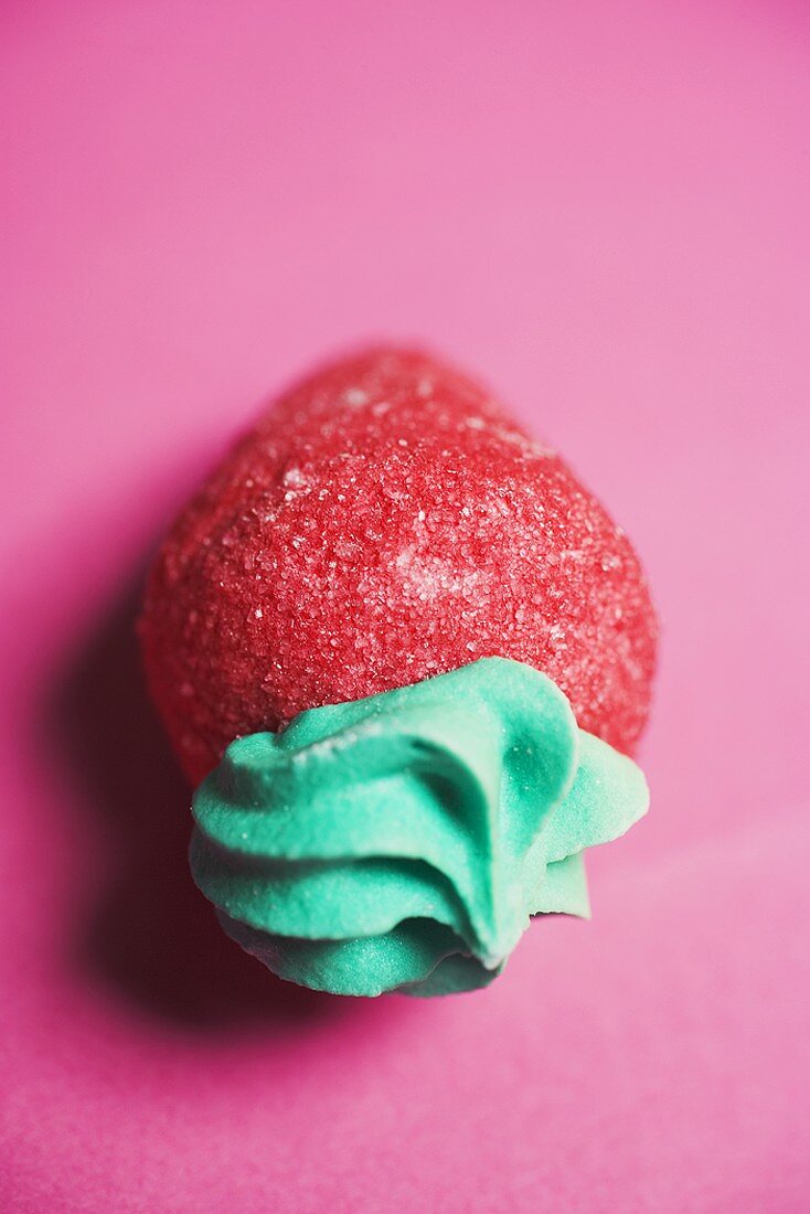 Sugar strawberry on red background